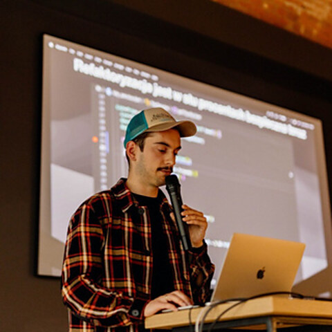 Adrian Kujawski presenting